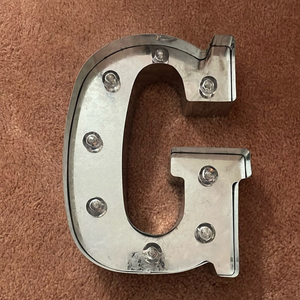 Silver G that lights up